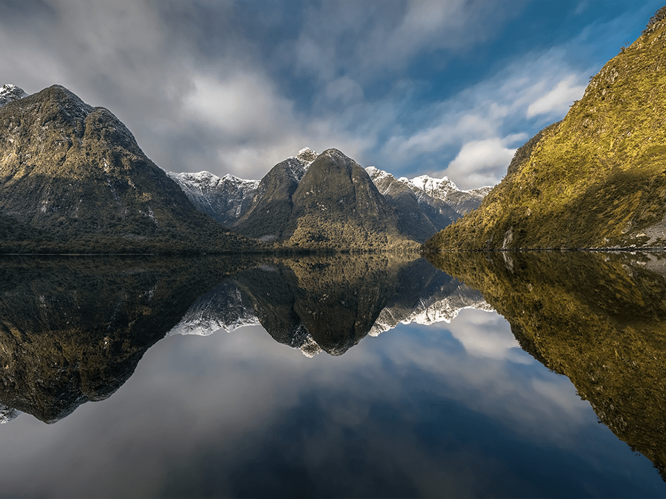 Reflection of the mountains on the waters of Doubtful Sound.